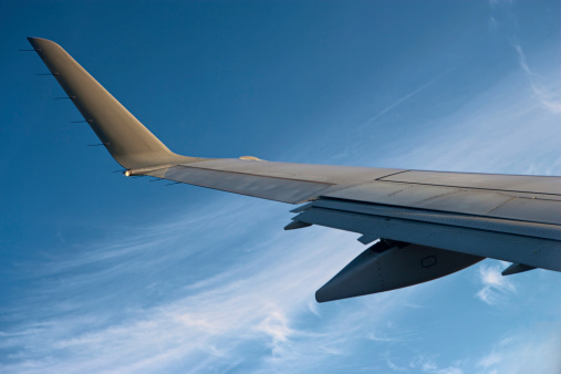 Airplane wing and the blue sky