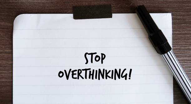 istock Coffee cup and note with handwritten text STOP OVERTHINKING, concept of to remind self to stop thinking too much, overcome anxiety and stress, Control negative thoughts - declutter mind and stay focus 1823759318