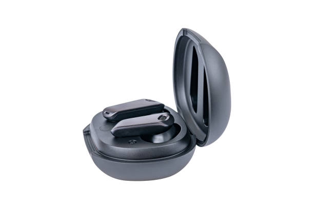 istock Wireless black bluetooth earphones with contactless charging isolated on white background. 1823762484