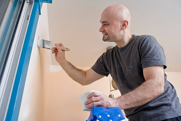 istock Painting on a ladder 182376274