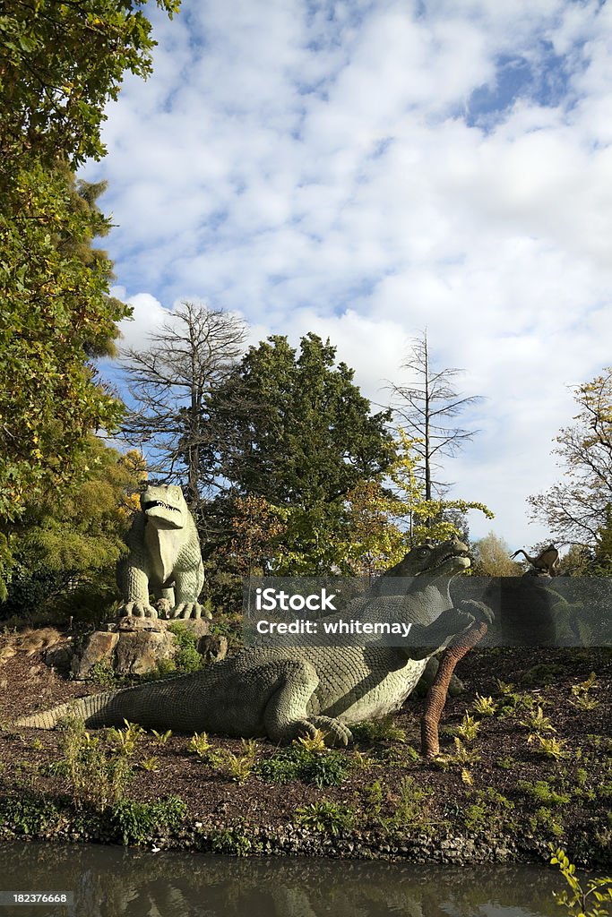 Crystal Palace dinosaurs "Very old models of dinosaurs in Crystal Palace Park, south london. They date from the early 1850s and were erected when the Crystal Palace (originally built for the Great Exhibition of 1851) was moved from Hyde Park to Sydenham Hill. They have been a tourist attraction for over 150 years. The two seen here are Iguanodon." Crystal Palace - London Stock Photo