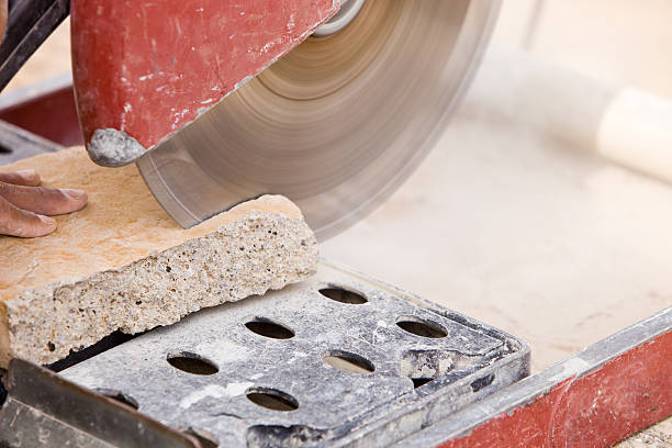 istock Mason Cutting a Stone with Dry Saw 182376814