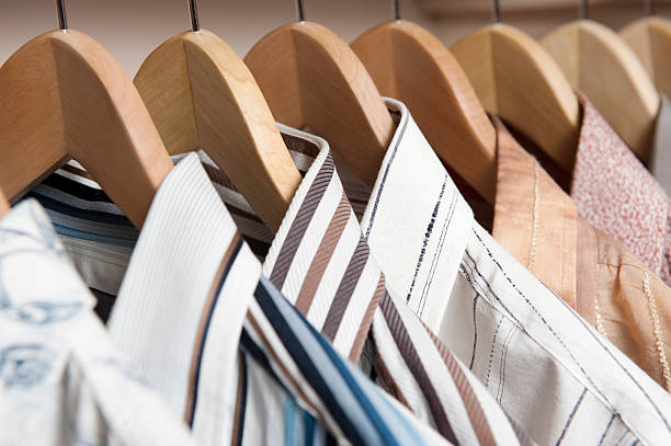 Shirts hanging on wooden coat hangers