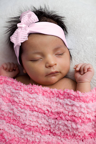 istock Newborn Baby with Pink Bow 182376941