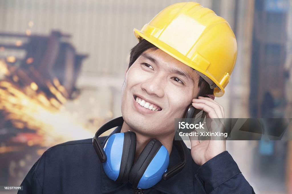 Young Engineer on the Phone Adult Stock Photo