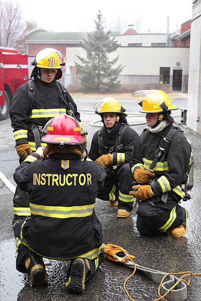 Firemen with instructor stock photo