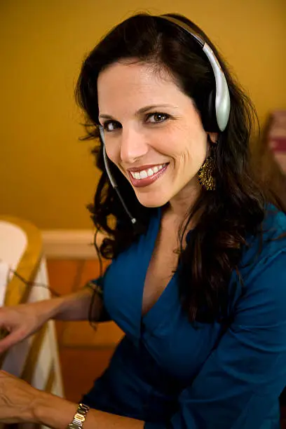 Mid adult woman wearing headset