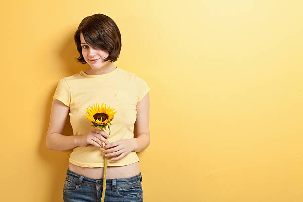 istock Woman with Sunflower 182378472