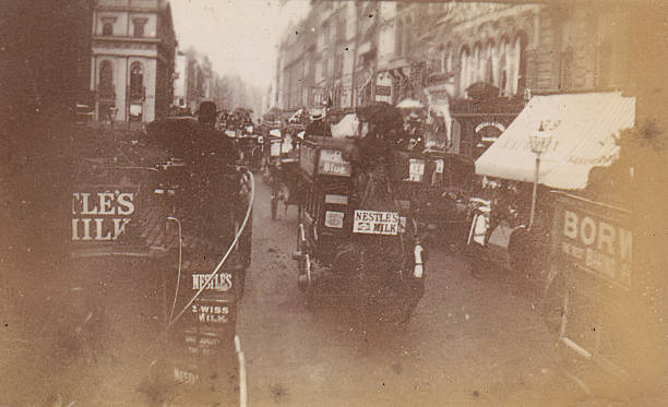 Victorian high street Vintage faded photograph of a Victorian high street, London circa 1890 bus livery stock pictures, royalty-free photos & images