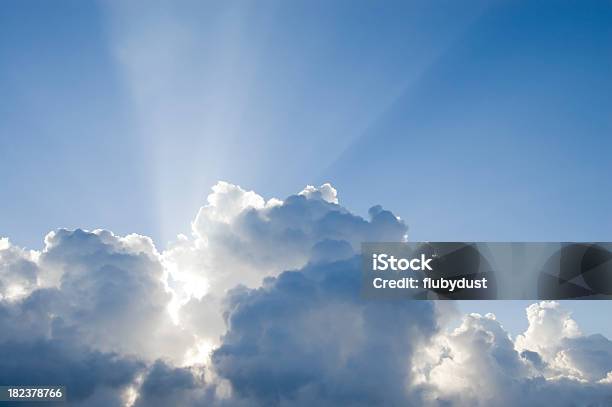 Sun Rays Permeating From Thick White Clouds Stock Photo - Download Image Now - Backgrounds, Blue, Clean