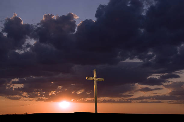 istock Solitary Weathered Cross at Sunset 182378780