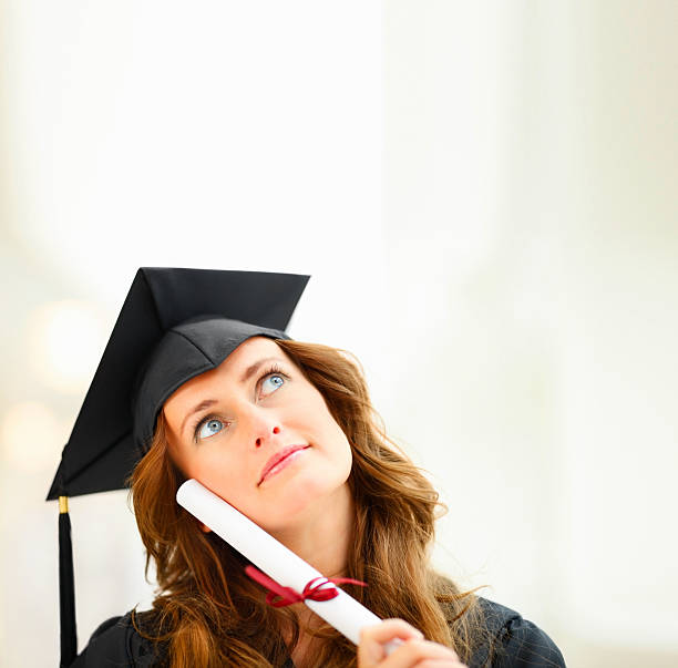 istock Young woman woth degree looking upwards 182378892
