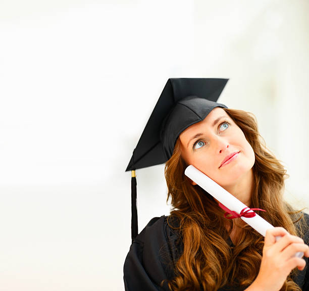 istock Young woman with her degree contemplating 182378896