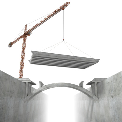 Bridge under construction with crane on a white background.This image could symbolize building a new connection or link.This is a detailed 3d rendering.