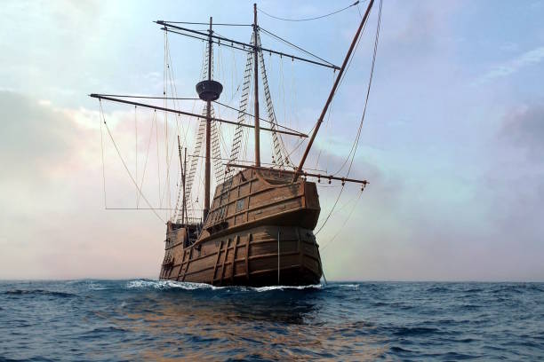 istock Pirate ship docking at sea on clam ocean water. 1823793442