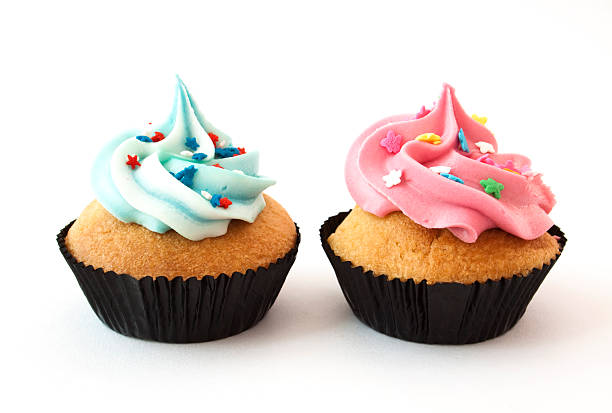 istock Cupcakes with pink and blue icing and edible stars 182379465