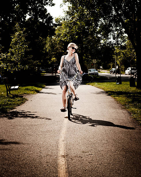 istock Riding her bike on a sunny summer day 182379472