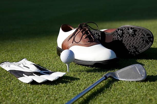 Golf Shoes, Gloves,Ball,Club On Green Grass stock photo