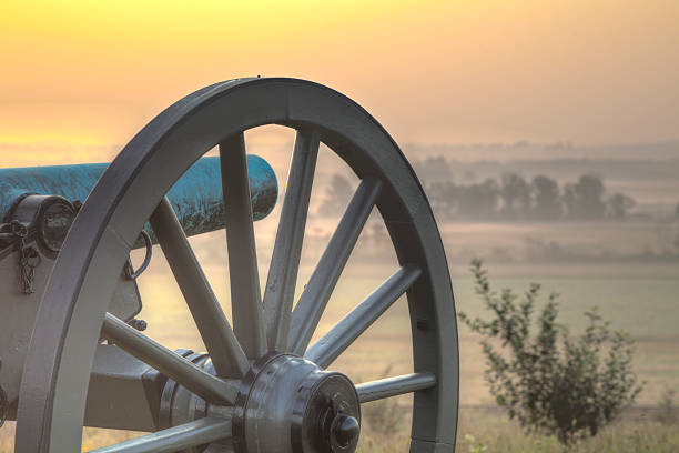 Sunrise at Gettysburg 2 "Dawn over the Gettysburg battlefield, cannon standing guard.I invite you to view some of my other Gettysburg Images:" gettysburg national military park stock pictures, royalty-free photos & images