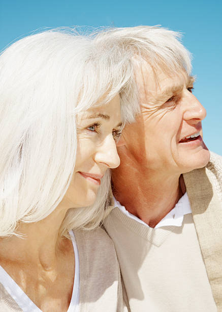 istock Romantic senior couple looking away 182381283