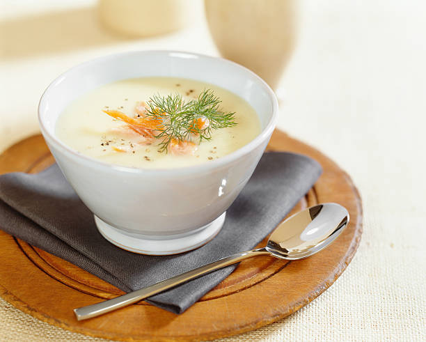 Cream of potato soup with salmon stock photo