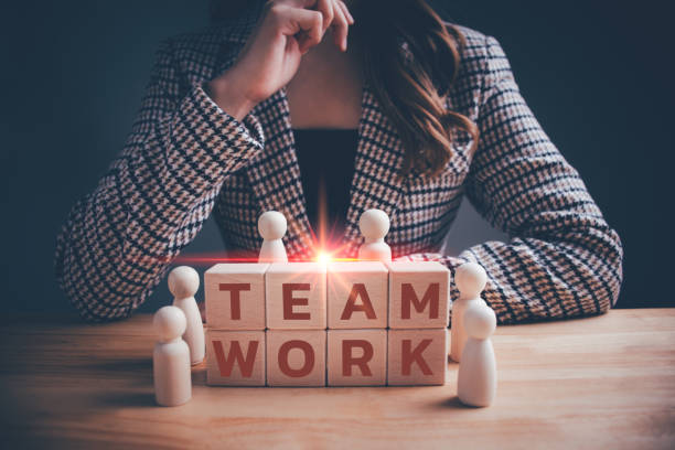 istock TEAMWORK text on wooden cube blocks and people symbol. Human resource management, Team, teamwork, leadership, brainstorming, corporation, smart teamwork for business organization concepts. 1823819770