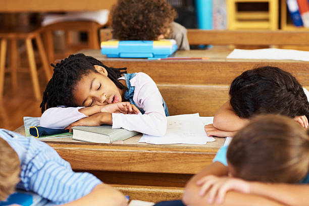 istock School children sleeping in their classroom 182382266