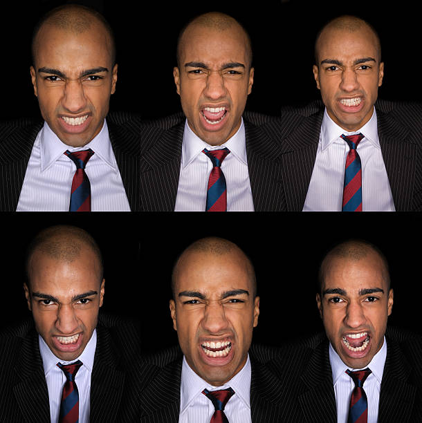 istock Furious Businessman On black background 182382357
