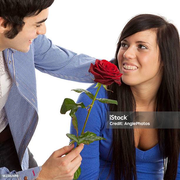 Young Man Gives His Girlfriend A Rose Stock Photo - Download Image Now - 16-17 Years, 18-19 Years, Adult