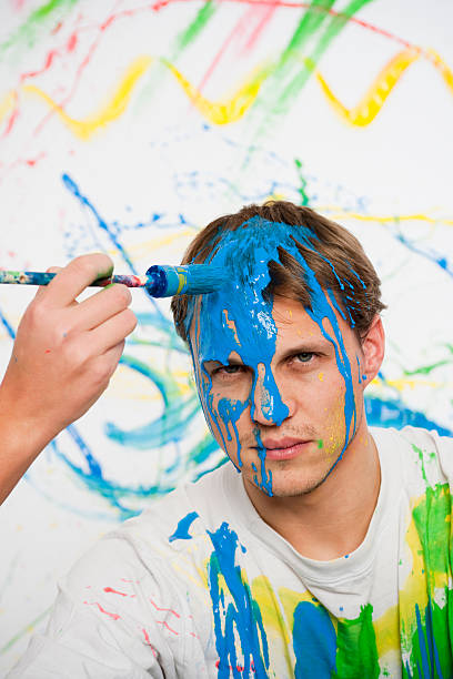 istock Painting the head of a man 182382532