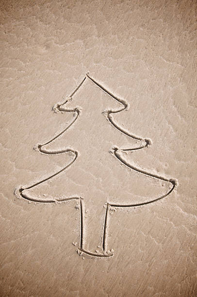 istock Simple Eco Friendly Christmas Tree Drawing Textured Brown Sand 182382848