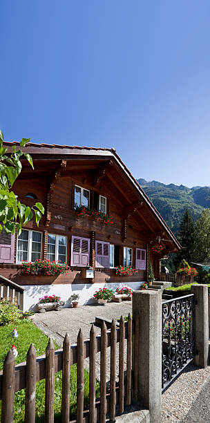 istock Blue sky over old house in the suisse alpes 182383299