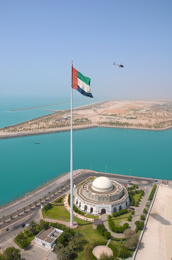  An aerial shot of UAE flag over Abu Dhabi. Helicopter tours operate from the Marina Mall