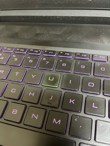 Laptop keyboard with different color on one keycap