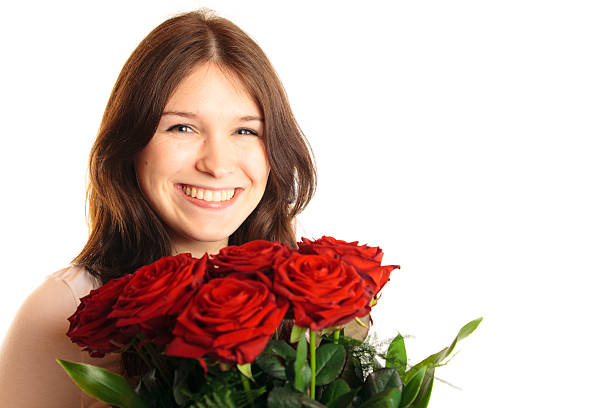istock young woman with roses 182384372