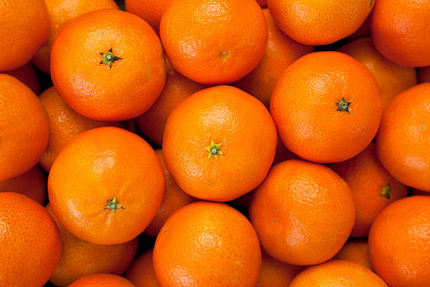 Tangerine background Mandarin tangerine background tangerine stock pictures, royalty-free photos & images