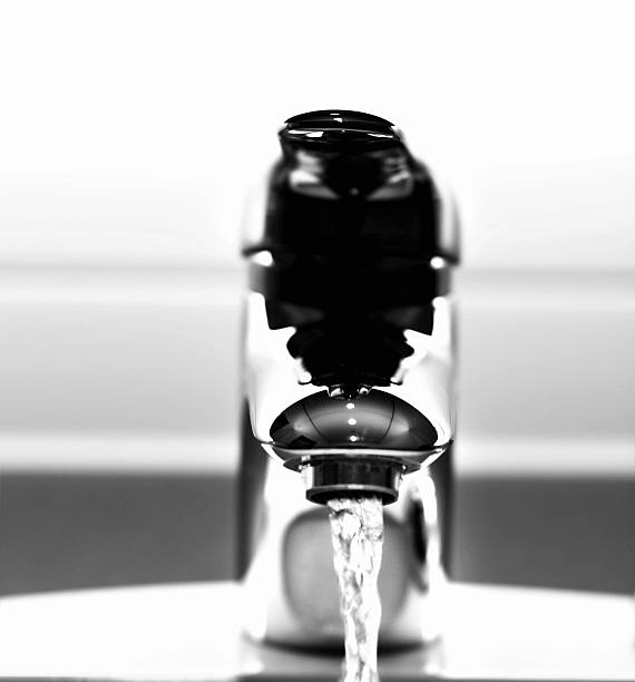 istock running water from bathroom faucet 182384666