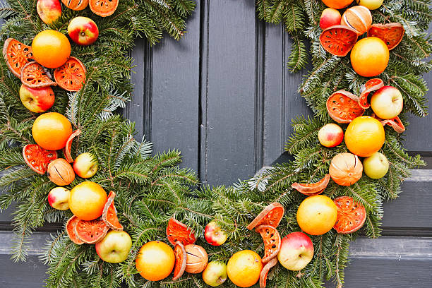 istock Natural Christmas wreath with apples and oranges 182385022