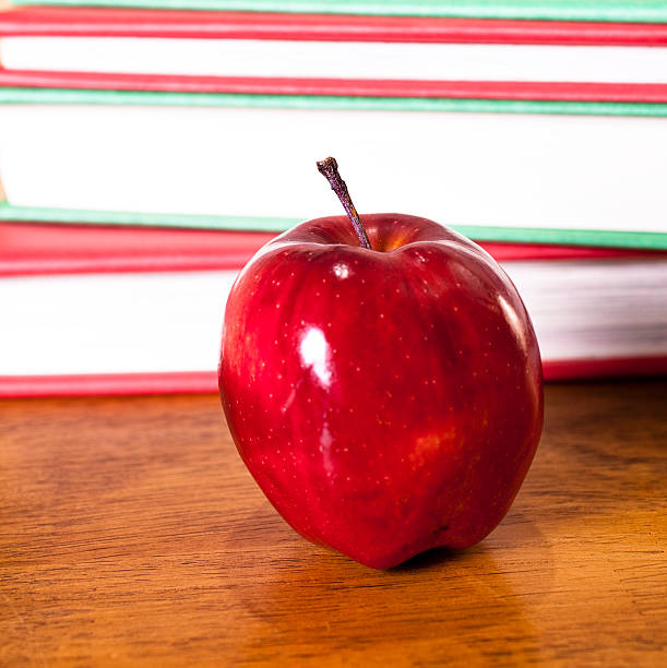 istock Colorful Books with red apple 182385575