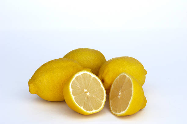 istock Close-up of Four Lemons Isolated on White Background 182386127