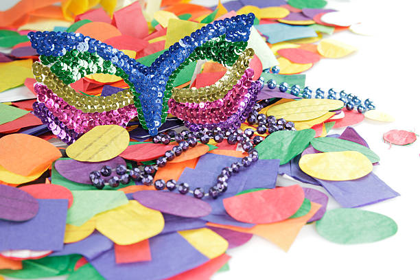 Oleggio, Italy - February 23, 2014: Carnival 2014. woman launch confetti during a parade through the streets of the city of Oleggio. Photo taken in a public area