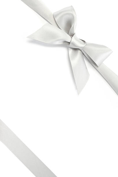 Silver Gift Ribbon & Bow "Silver gift ribbon and bow, isolated on white background.Similar images -" satin photos stock pictures, royalty-free photos & images