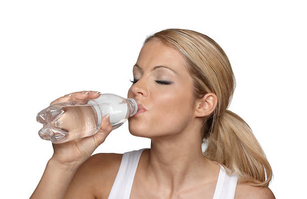 istock Fitness woman drinking water 182386745