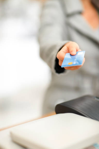 istock Mid section of a lady holding credit card 182387026