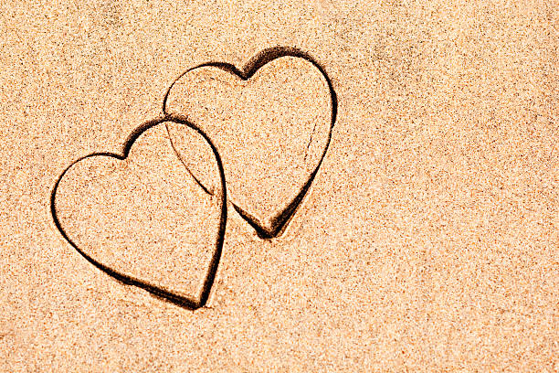 istock Valentine hearts on sand 182387055