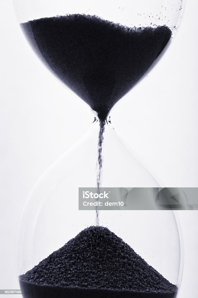 Sand falling through hourglass "Sand falling through hourglass, close-up" Sand Stock Photo