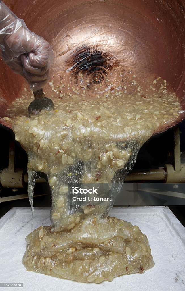 Turkish Delight Factory Worker is pouring melted turkish delight into a tray. Turkish Delight Stock Photo