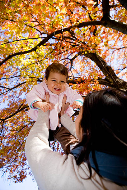 счастливый малыш - babies and children cheerful low angle view vertical стоковые фото и изображения
