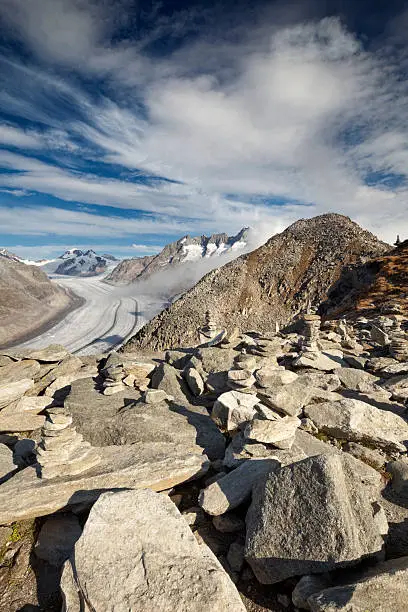 Stone cairns at the Aletsch glacier - Europe's largest glacier - in Switzerland.