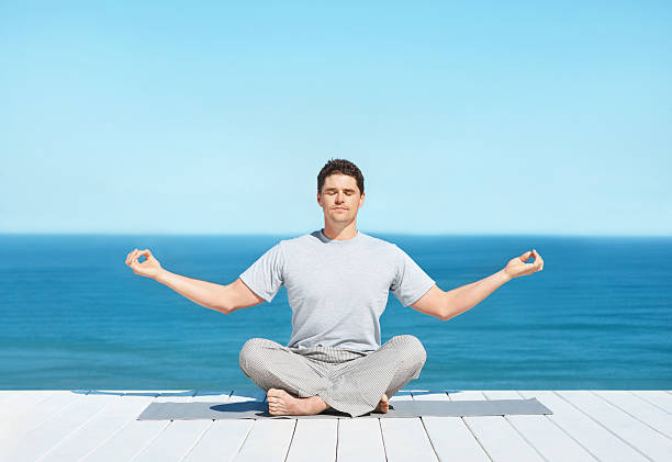 istock Man meditating in a lotus position 182389717